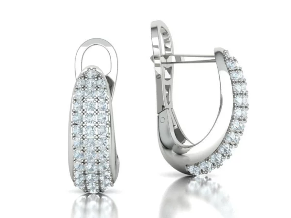 A pair of Bespoke Huggie Earrings Diamond, artistically displayed, highlighting the unique, tailor-made design and the radiant shine of the carefully selected diamonds.