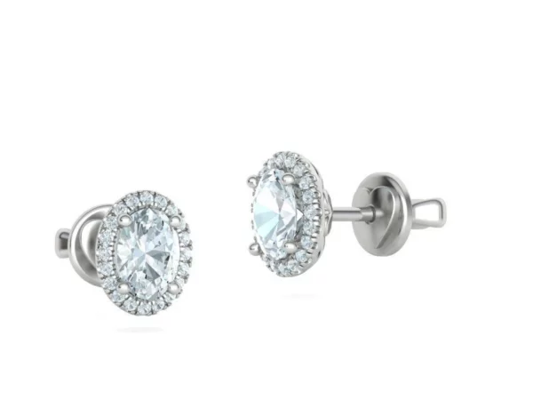 Close-up of delicate oval diamond studs earrings with a focus on the brilliant-cut diamonds, highlighting their clarity and unique oval shape, set in a fine, secure mount.