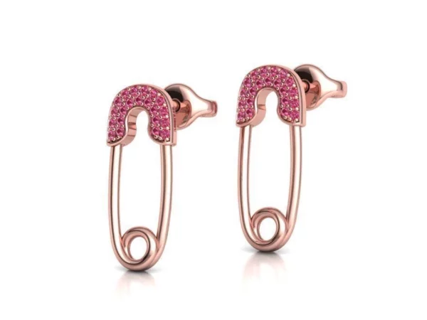 A pair of custom-made Diamond Safety Pin Stud Earrings displayed against a sophisticated backdrop, highlighting their unique and unconventional design with radiant diamonds embedded in a sleek, silver safety pin-shaped structure.
