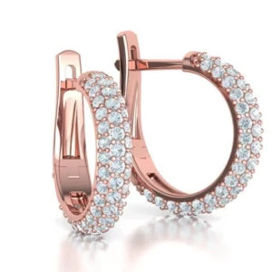 Elegant hoop diamond earrings featuring sparkling diamonds set in a seamless hoop design, displayed against a soft, velvet background for a luxurious presentation.
