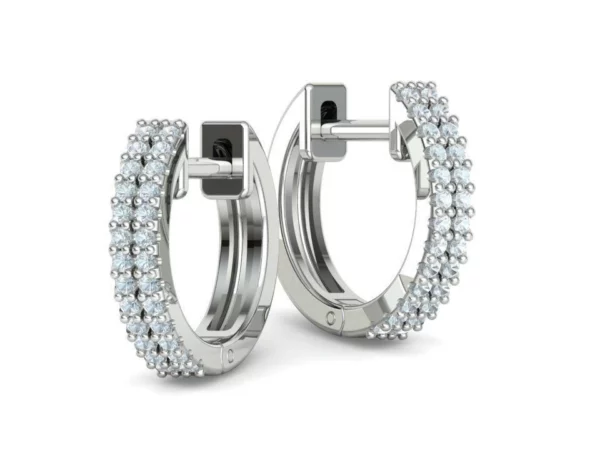 Pair of chic small hoop earrings adorned with bright, clear diamonds, elegantly crafted to provide a subtle yet luxurious addition to both day and evening wear.