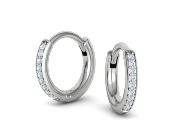 A close-up of elegant silver hoop earrings with a subtle shine, showcasing their sleek and simple design against a white background.