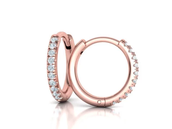 A pair of dazzling hoop earrings with intricate French pave setting, where small gemstones catch the light, creating a radiant effect, elegantly presented in a gift box.