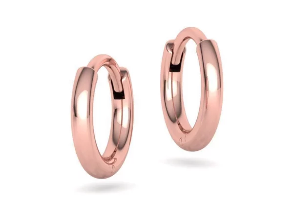 Polished, circular hoop earrings designed for women, displayed gracefully, reflecting light beautifully, emphasizing their simple yet classic design, perfect for versatile fashion statements.