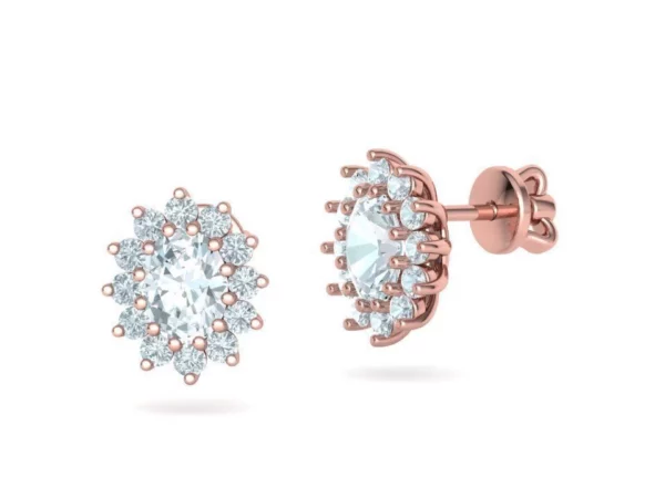 A pair of Stud Earring Diana style displayed on a white satin cloth, showcasing their refined craftsmanship with a delicate, diamond-like centerpiece surrounded by a subtle silver casing.