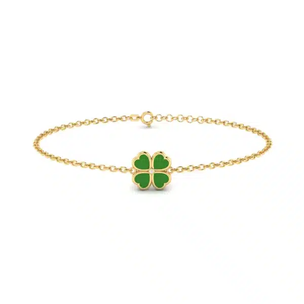 Close-up of a clover-shaped bracelet with vibrant green enamel and a sparkling central diamond on a gold or silver band.